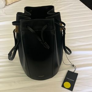 100 % leather. Black leather. Made in Italy. Is is branch new bag. Never use.